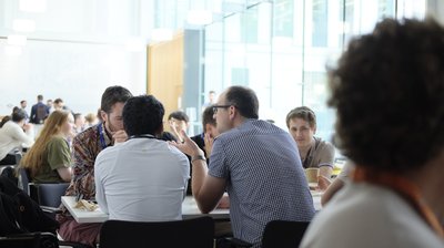 Attendees during lunch at TartanQEC 2026, Informatics Forum, University of Edinburgh