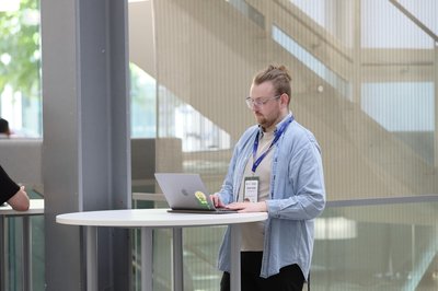 At the Pride in Quantum social during TartanQEC 2026, Informatics Forum, University of Edinburgh