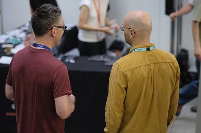 Attendees chatting during registration and coffee at TartanQEC 2026, Informatics Forum, University of Edinburgh